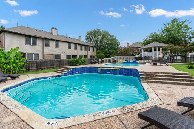 View of swimming pool with an outdoor hot tub, a gazebo, and a patio area | Image 22