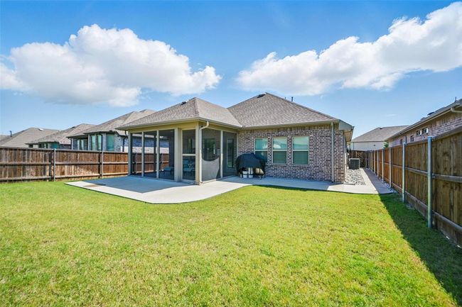 Back of house featuring a patio, brick siding, a shingled roof, and a sunroom | Image 22
