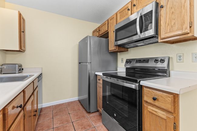 Kitchen with Oak Cabinetry and new oil rubbed bronze hardware | Image 13