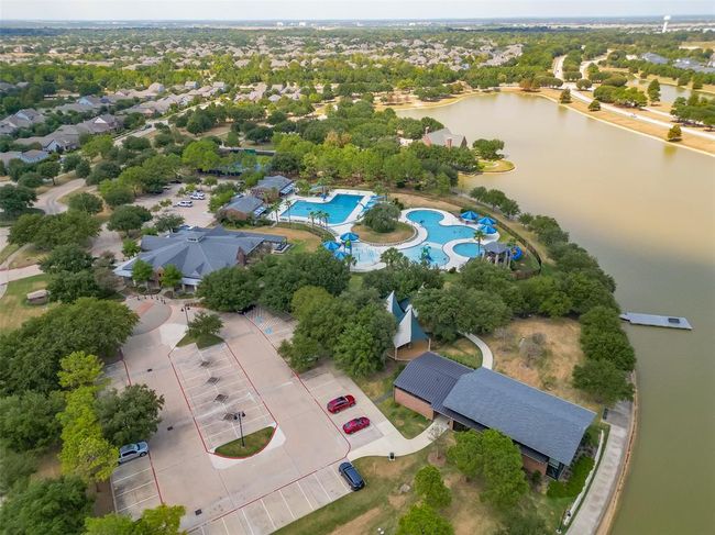 Features a single-family home with a spacious yard in Bridgeland, a master-planned community offering lakes, pools, sidewalks, and green spaces. | Image 38
