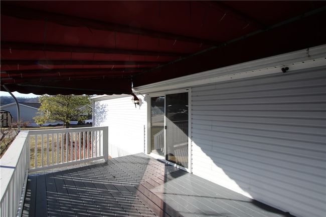 Quality Trex Decking & Vinyl Railing on 15x9 Side Porch w/ Awning for shade | Image 23