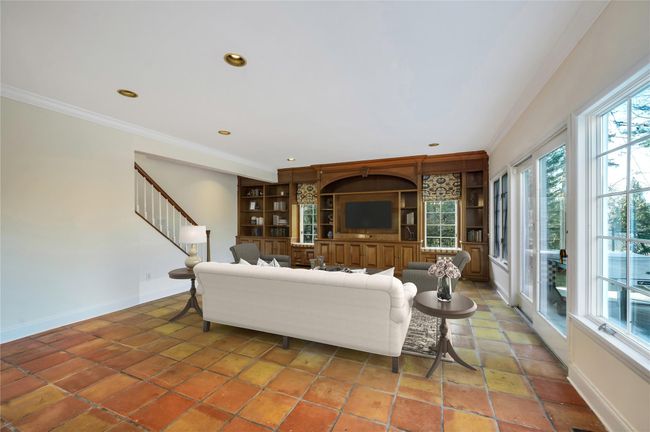 Family room with doors to rear - property - virtually staged | Image 8