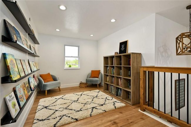 Living area featuring LVP wood finished floors | Image 34