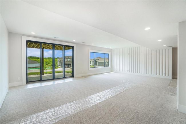 Unfurnished room featuring baseboards, recessed lighting, and light colored carpet | Image 25