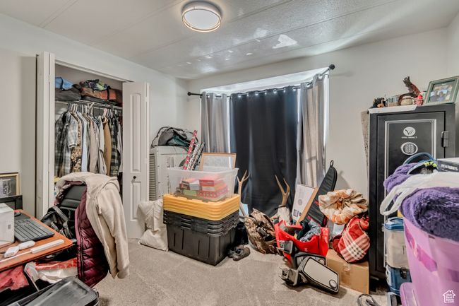 Bedroom with carpet floors and a closet | Image 10