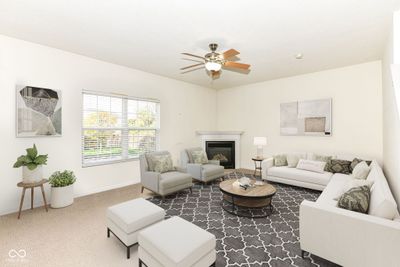 Lots of entertaining space in the great room! This virtually staged photo shows a possible furniture arrangement. | Image 2