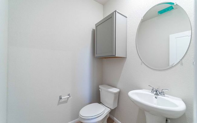 Half bath with toilet and a sink | Image 10