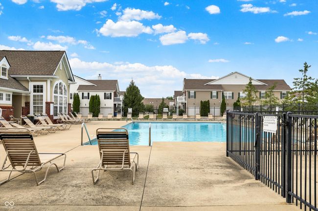 community pool featuring a patio and a residential view | Image 37