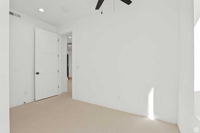 Spare room with light carpet, recessed lighting, and ceiling fan | Image 58