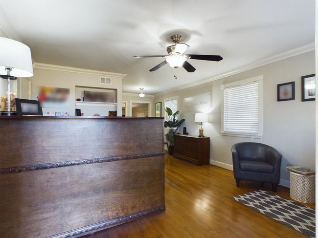 Welcome area featuring ornamental molding and a ceiling fan | Image 6