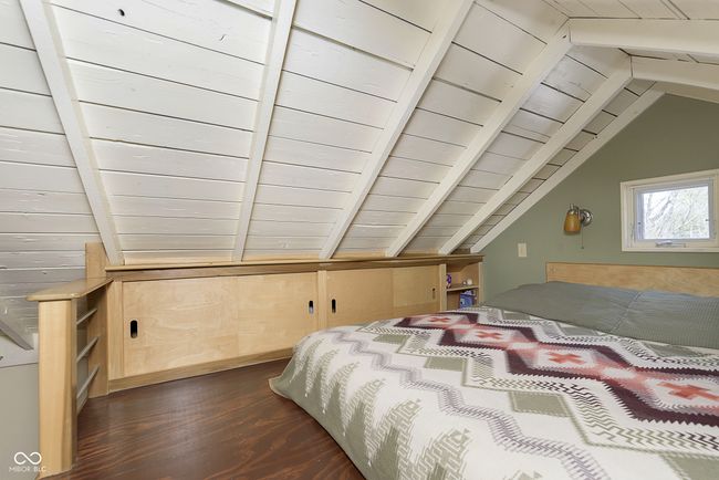 The loft area has storage space, too, along with beautiful hardwood floors! | Image 18