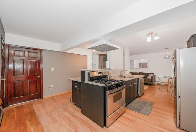Kitchen with island exhaust hood | Image 4