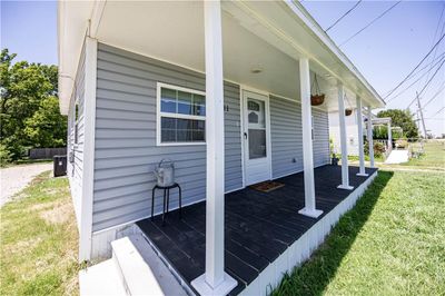 View of property exterior with a lawn | Image 2