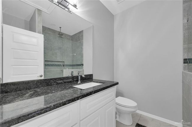 Bathroom with a stall shower and vanity | Image 14