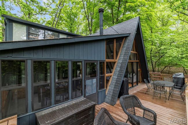 Wooden terrace with outdoor dining space | Image 63