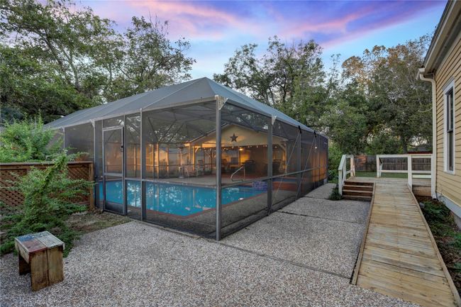 ENTRANCE TO BACK SIDE OF HOUSE & POOL FROM THE DRIVEWAY. | Image 27