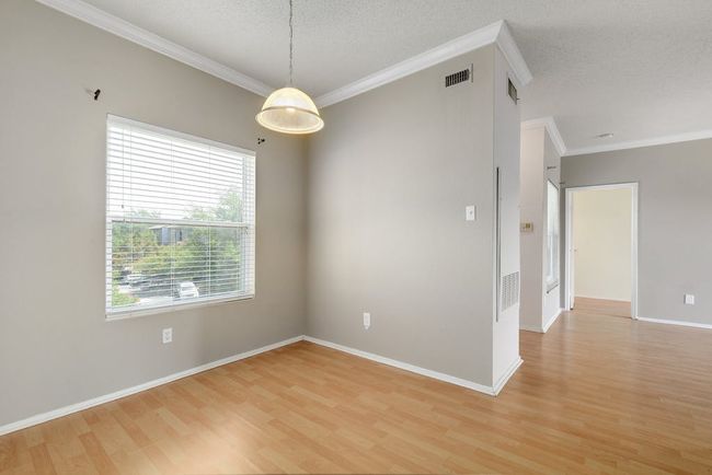 Big window in dining area allows for a light and bright space. | Image 6
