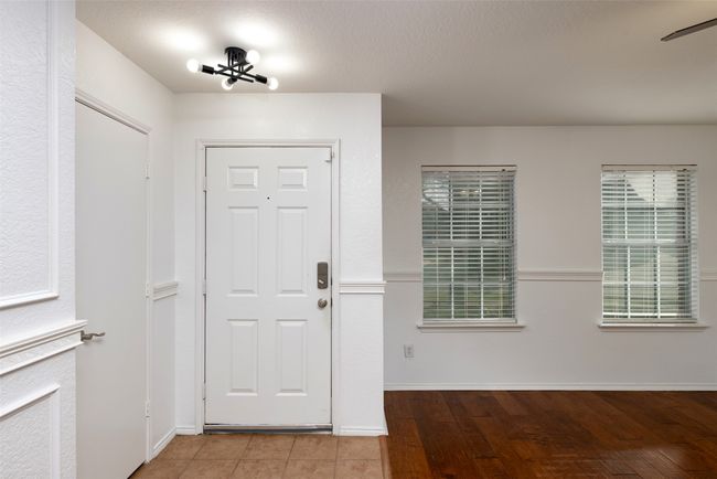 Foyer with baseboards and wood finished floors | Image 7