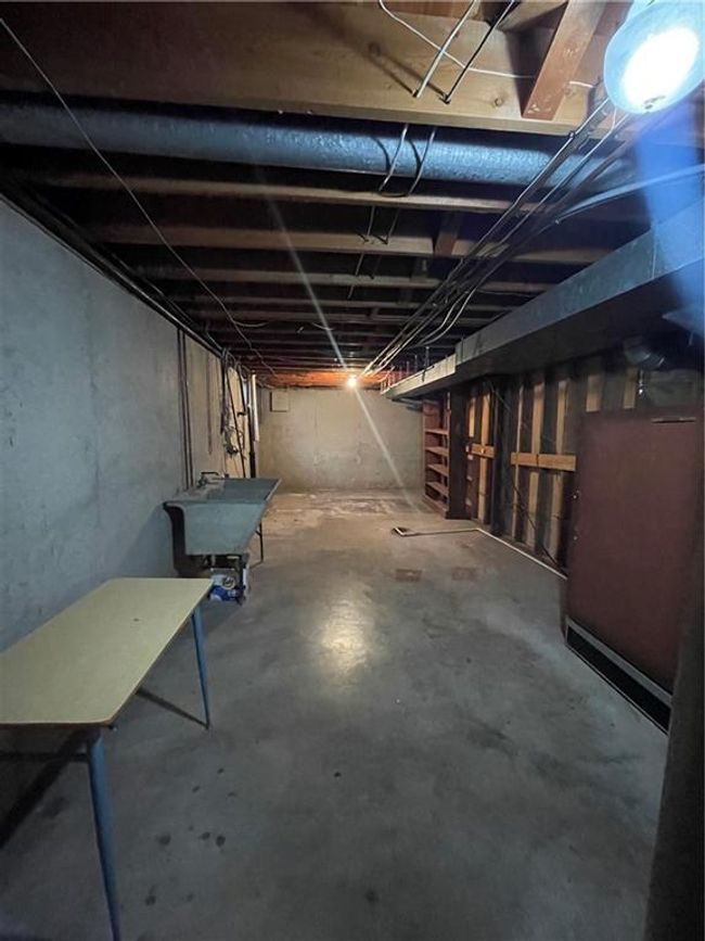 Unfinished below grade area featuring a sink | Image 35