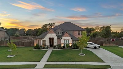 French country style house featuring a lawn | Image 1