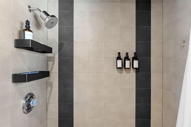 Bathroom featuring a tile shower | Image 31
