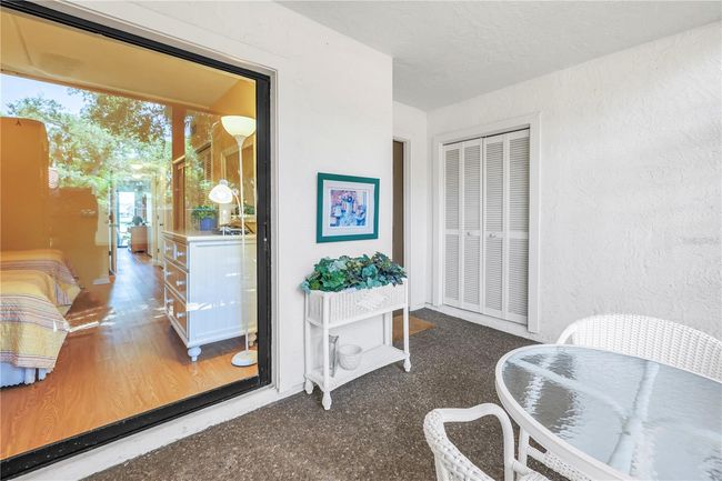 Second bedroom overlooking front covered porch lanai | Image 30