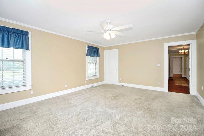 Spacious bonus room in back of house - access to basement | Image 26