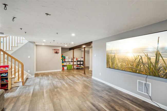 Game room with wood finished floors and recessed lighting | Image 17