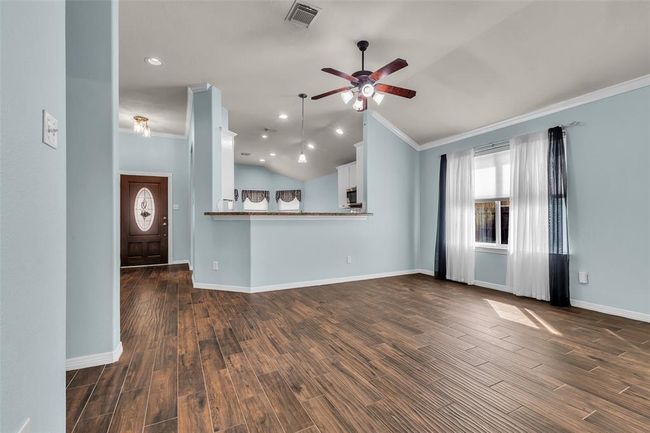 Super clean and well maintained with designer paint and tile flooring through the main living areas. | Image 5