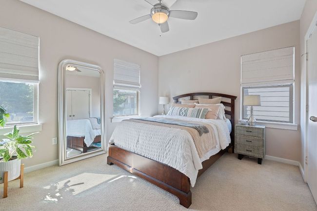 Carpeted bedroom with baseboards and ceiling fan | Image 16