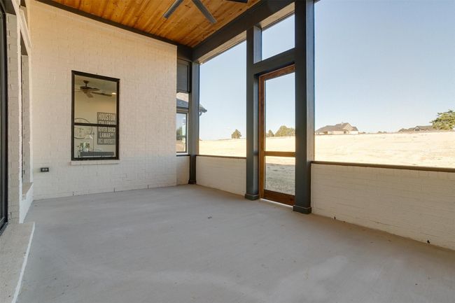Unfurnished sunroom with ceiling fan and wooden ceiling | Image 31