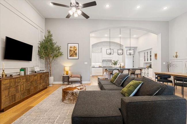 Living room with arched walkways, ceiling fan, light wood-style floors, and recessed​​‌​​​​‌​​‌‌​‌‌​​​‌‌​​‌‌​‌​​​​​‌ lighting | Image 16