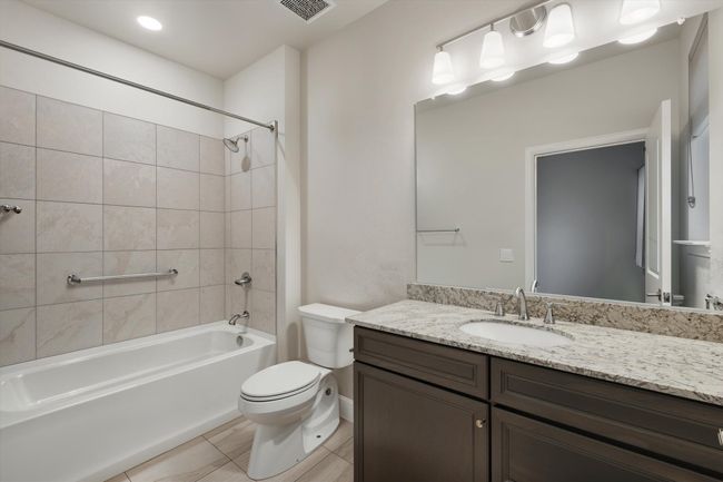 2nd Bathroom featuring vanity, bathing tub / shower combination, and tile flooring | Image 20