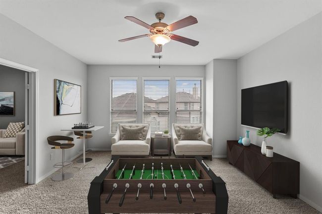 Virtually Staged: Conveniently upstairs is this fabulous game room! Complete with plush carpet, large windows with privacy blinds, and a ceiling fan. Convert this space into a kids' hangout, an adults hideaway, or whatever you can imagine! | Image 18