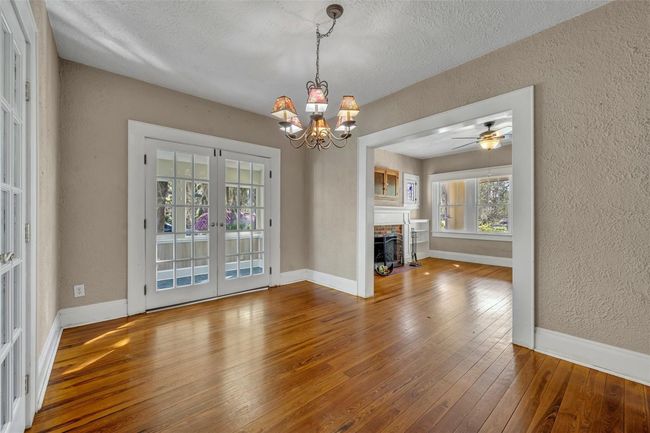 Dining room with french doors to sunroom | Image 4