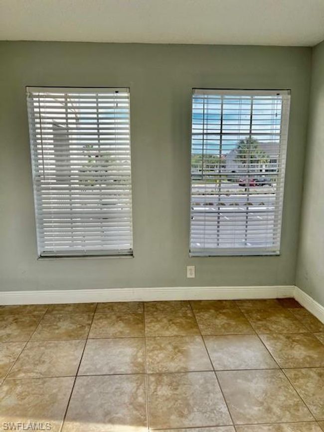 Empty room featuring tile patterned flooring and baseboards | Image 17