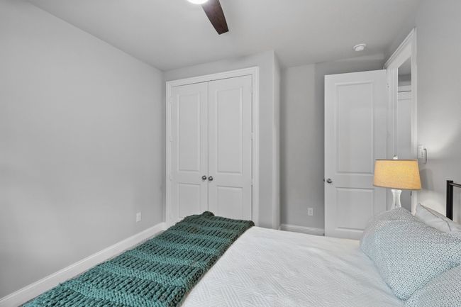Bedroom featuring a closet, baseboards, and ceiling fan | Image 9