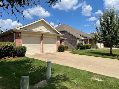 Single story home with a two car garage. | Image 2