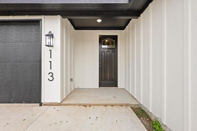 View of front of house featuring a garage | Image 2