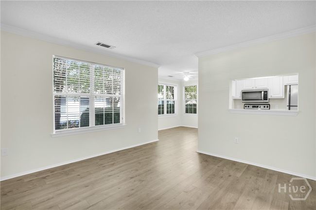 Living room looking into dining and kitchen | Image 8