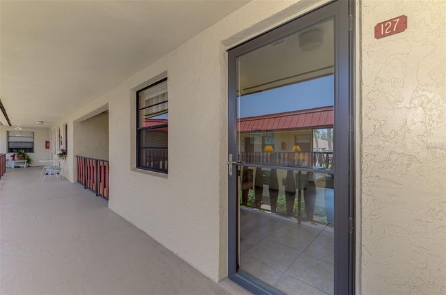 Glass Front Entry, 2nd Floor Condo Rotonda West, Minutes Boca Grande | Image 8
