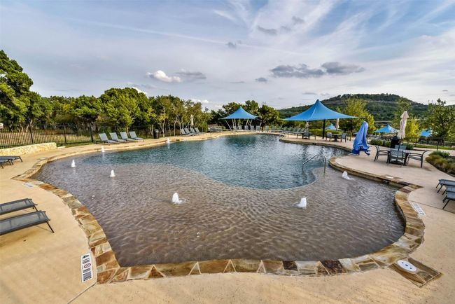 Community pool with a patio | Image 25