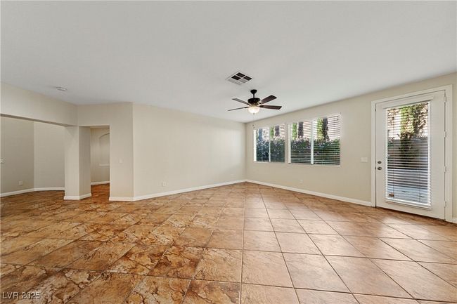 Unfurnished room featuring plenty of natural light and a ceiling fan | Image 18