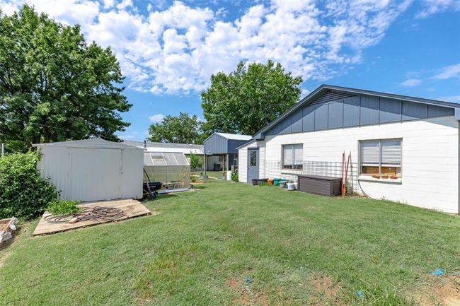 View of yard featuring a shed | Image 41