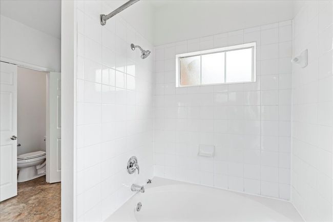The ensuite offers a garden tub and natural light. | Image 21