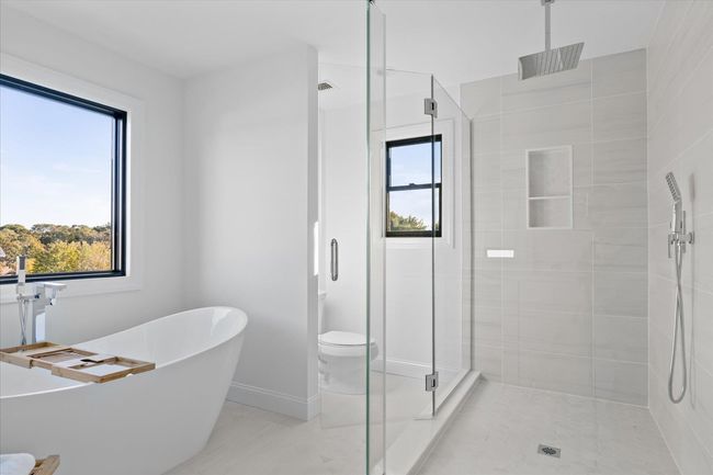 Bathroom with toilet and separate shower and tub | Image 18
