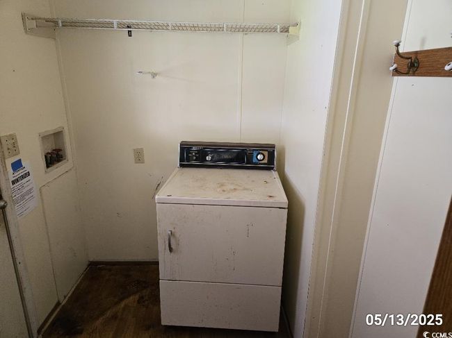Washroom with washer / dryer and dark wood finished floors | Image 14