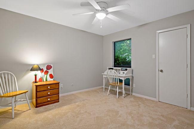 Carpeted bedroom space featuring baseboards and a ceiling fan | Image 16