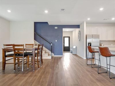 Craftsman-style home featuring cooling unit and a front yard | Image 1