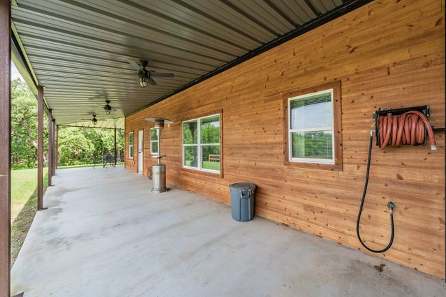 View of patio / terrace with ceiling fan | Image 7